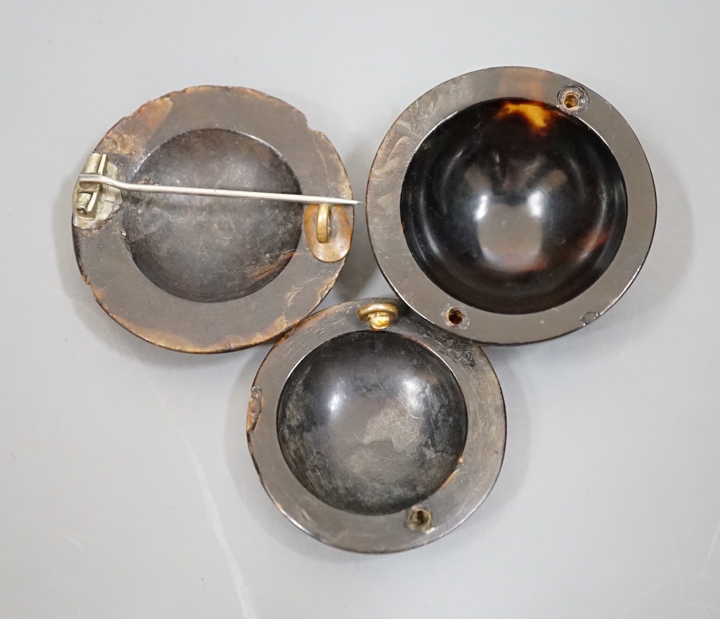 Three 19th century gold and silver pique work tortoiseshell brooches